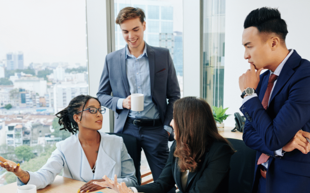 Blog Covers (10) Business team engaged in storytelling session during digital transformation workshop, fostering connection and shared vision.