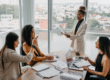 Woman sitting thoughtfully while engaging with Change Leadership concepts in a calm workspace.